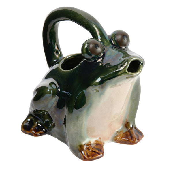 A green stoneware watering pitcher designed to resemble a frog.